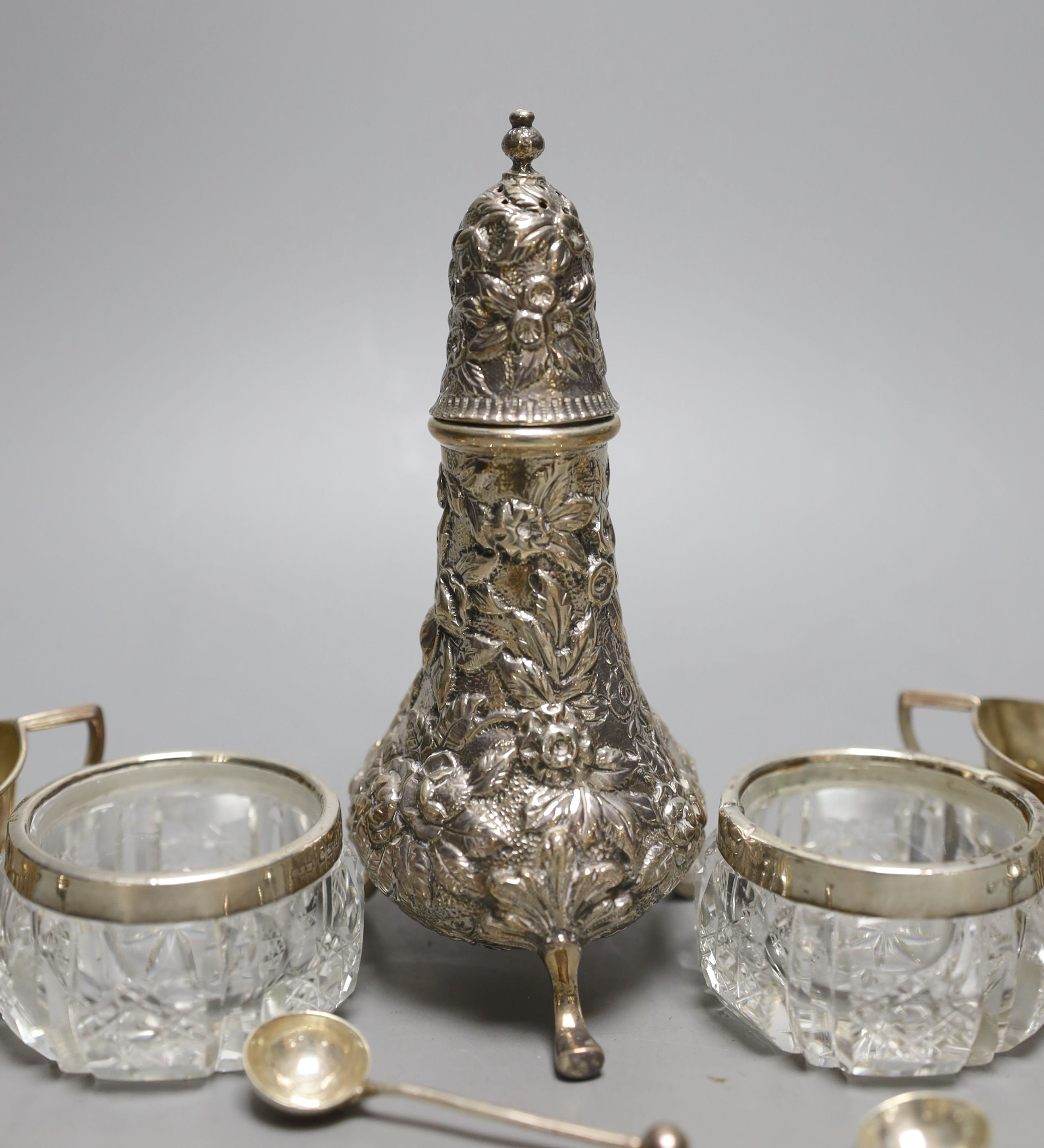 A set of four late Victorian demi-fluted silver salts and spoons, two other salts and a caster.